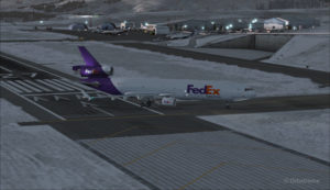 A FedEX Md-11 is exiting runway 09 at the Telluride airport (KTEX) (FSX)