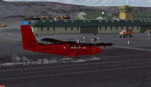 A British Antarctic Survey Twin Otter aircraft is landing on the Rothera runway, Antarctica