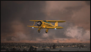 Beech Staggerwing aircraft over Saskatchewan, Canada.