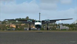 Frontal view of the Shrike Commander 500S about to land in front of the hangar at AYPY.