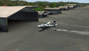 The Shrike Commander lands a few feet before the hangar. Additional power is mandatory to reach the hangar.