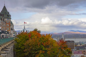 A view of a section of the Château Frontenac with the mountains in the background during Fall 2018.