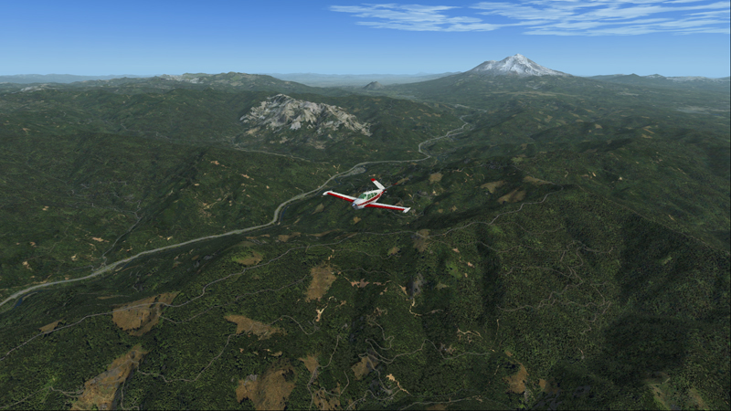 Bonanza en vol entre Mount Shasta et le barrage Shasta.