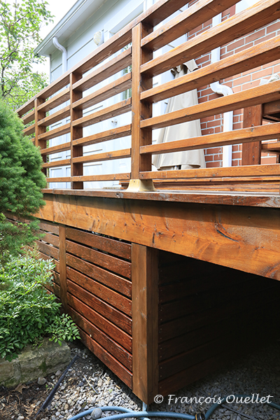 Close-up of the red cedar siding under the patio.