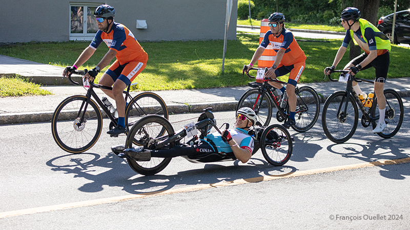 Group of cyclists in the Grand défi Pierre Lavoie (GDPL) 2024 in action at Québec.