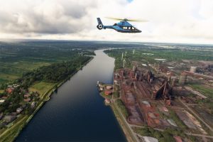 Hélicoptère Airbus H160 au-dessus d'installations industrielles de Bremen avec MSFS2020