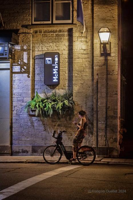 Young woman in the night in Quebec City, 2024.