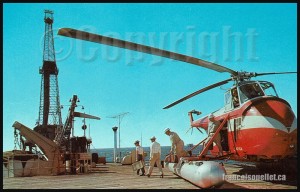Offshore-drilling-rig-in-the-Gulf-of-Mexico-with-workers-and-helicopter-on-aviation-postcard-web (1)   